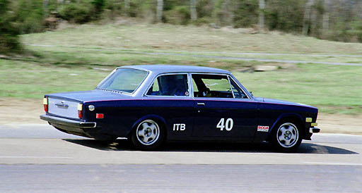 The low 1972 ITB Volvo 142 of James Stem accelerates away from turn 1